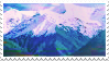 A stamp with a snowy blue mountain range